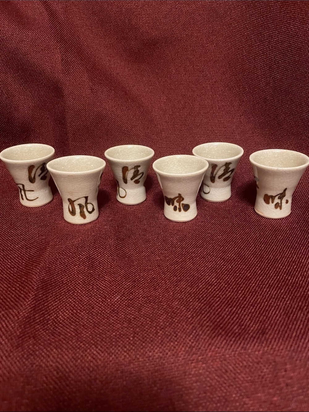 Handcrafted White Ceramic Sake Cups with Brown Calligraphy Set of 6